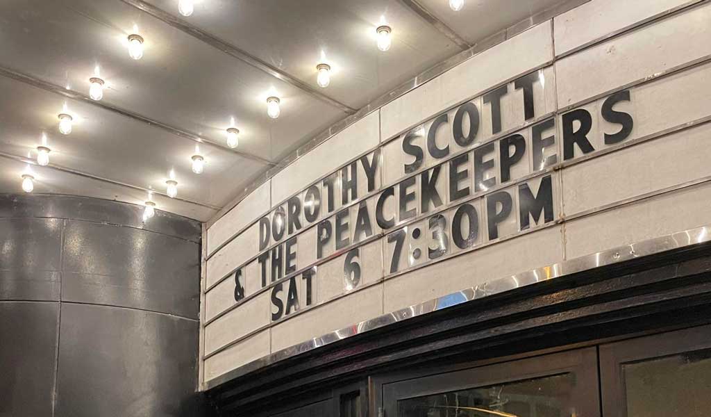 Dorothy Scott & the Peacekeepers band at the Tarlton Theatre marquee in Green Bay, Wisconsin